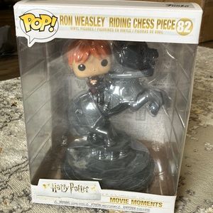 Funko Pop Harry Potter Movie Moments featuring Ron Weasley riding chess piece.